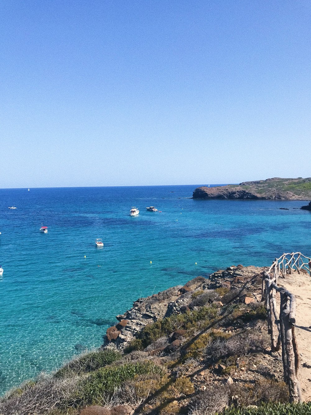 a view of a beach with boats in the water