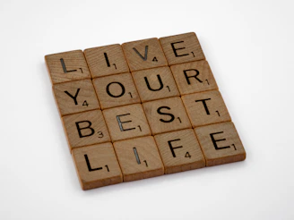 a scrabble tile that says live your best life