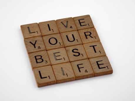 a scrabble tile that says live your best life