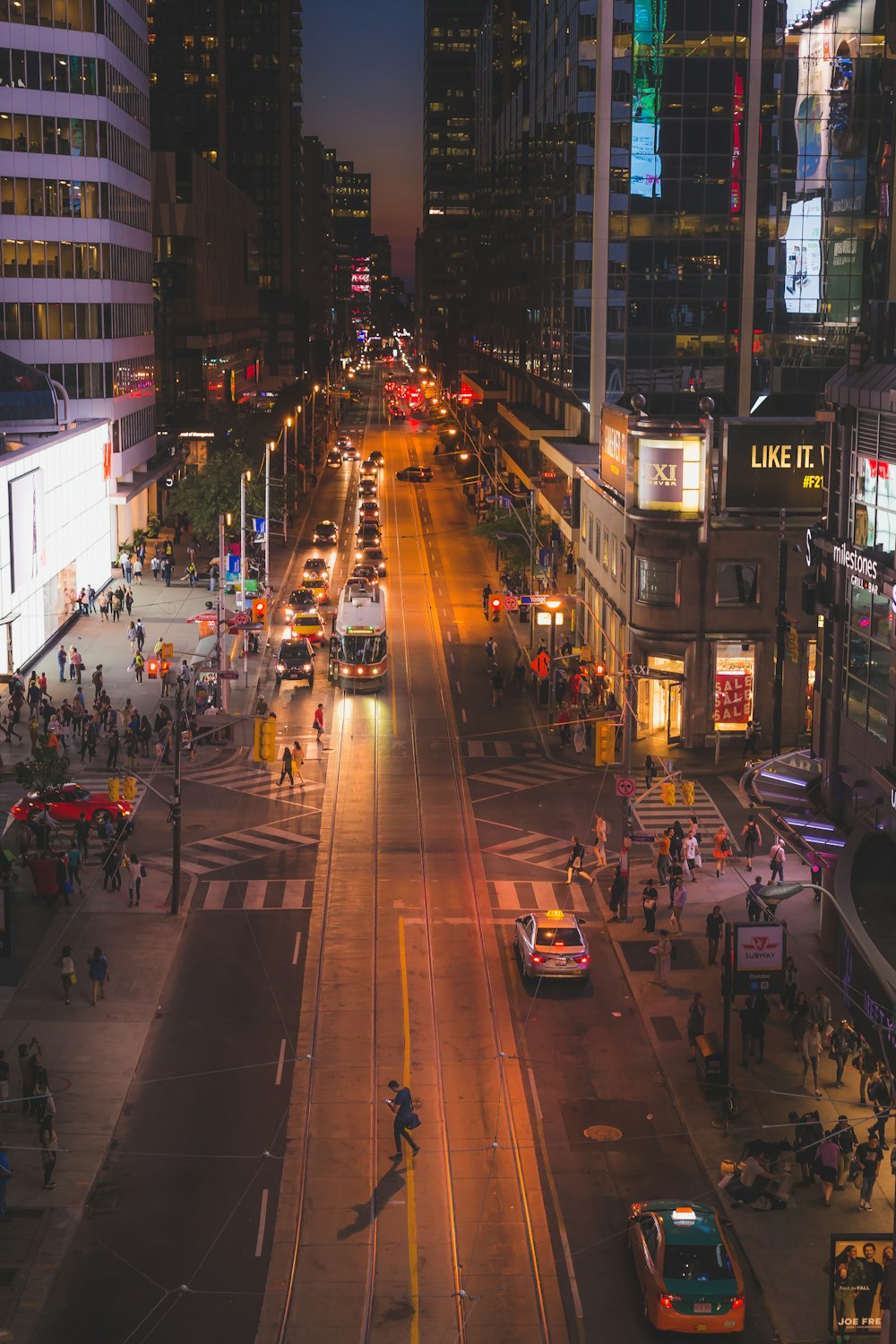 a busy city street at night with a lot of traffic