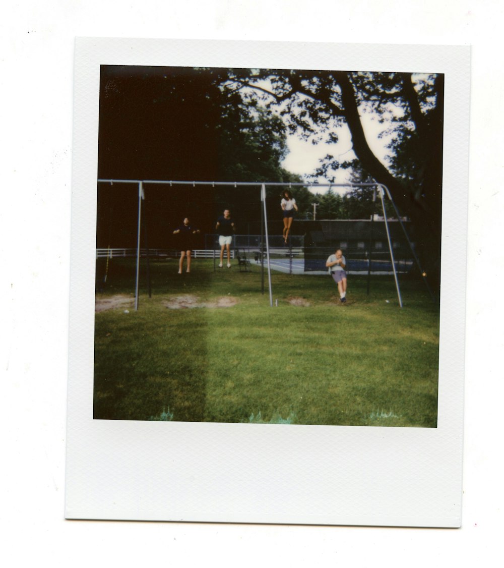 a group of people playing a game of tennis