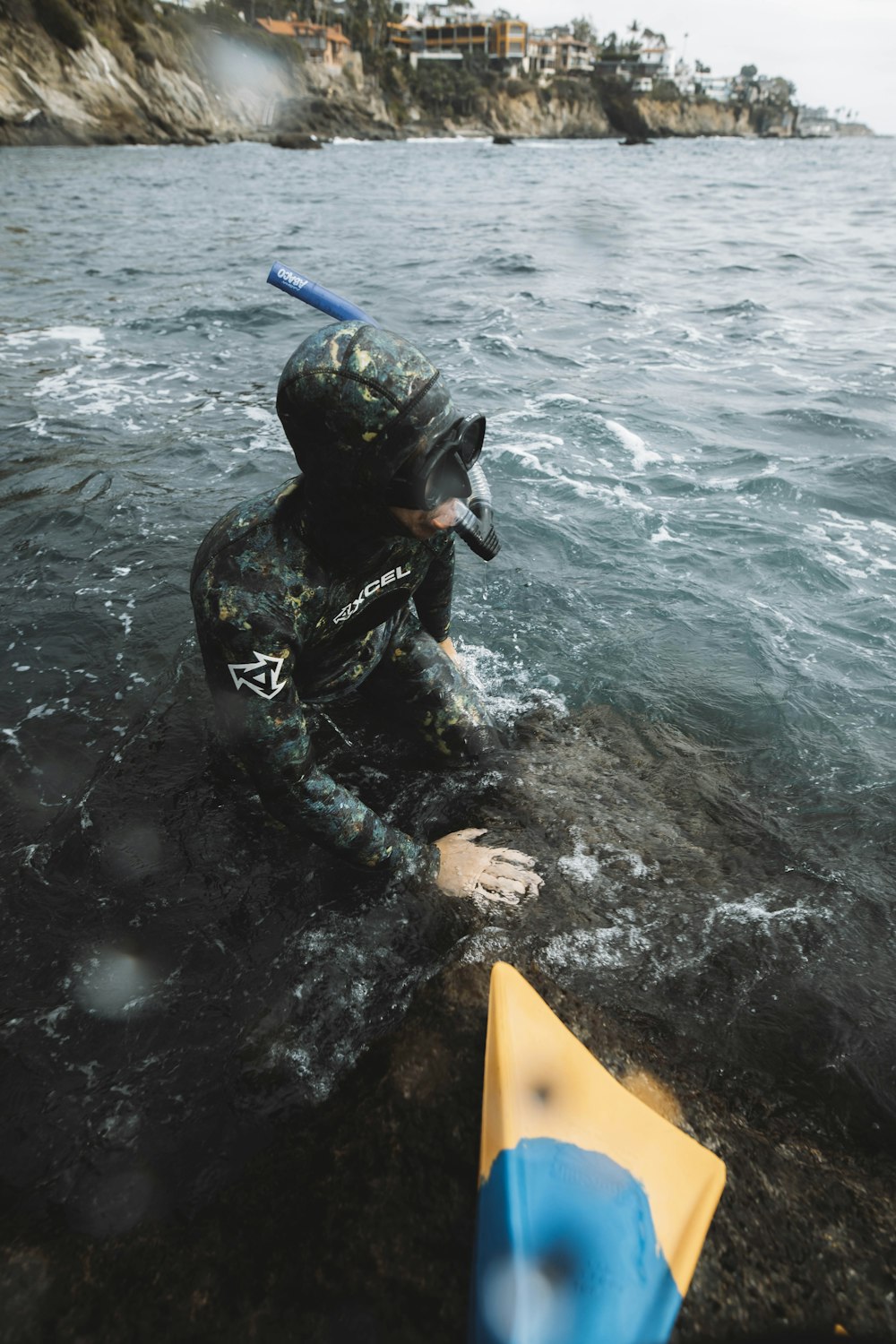 a person in a wet suit in the water