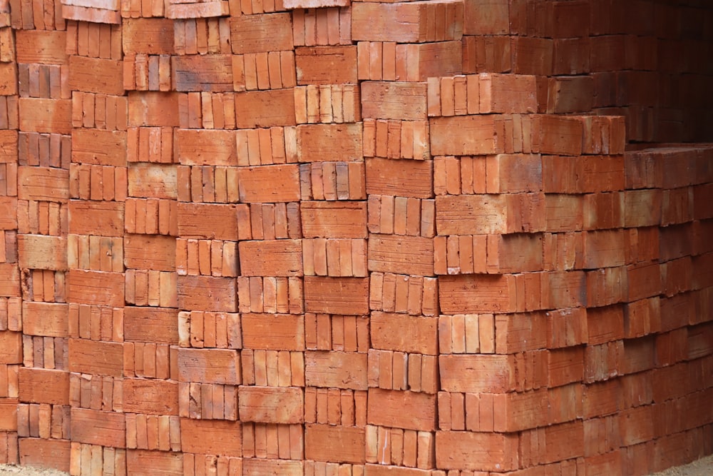 a pile of bricks sitting on top of a sidewalk