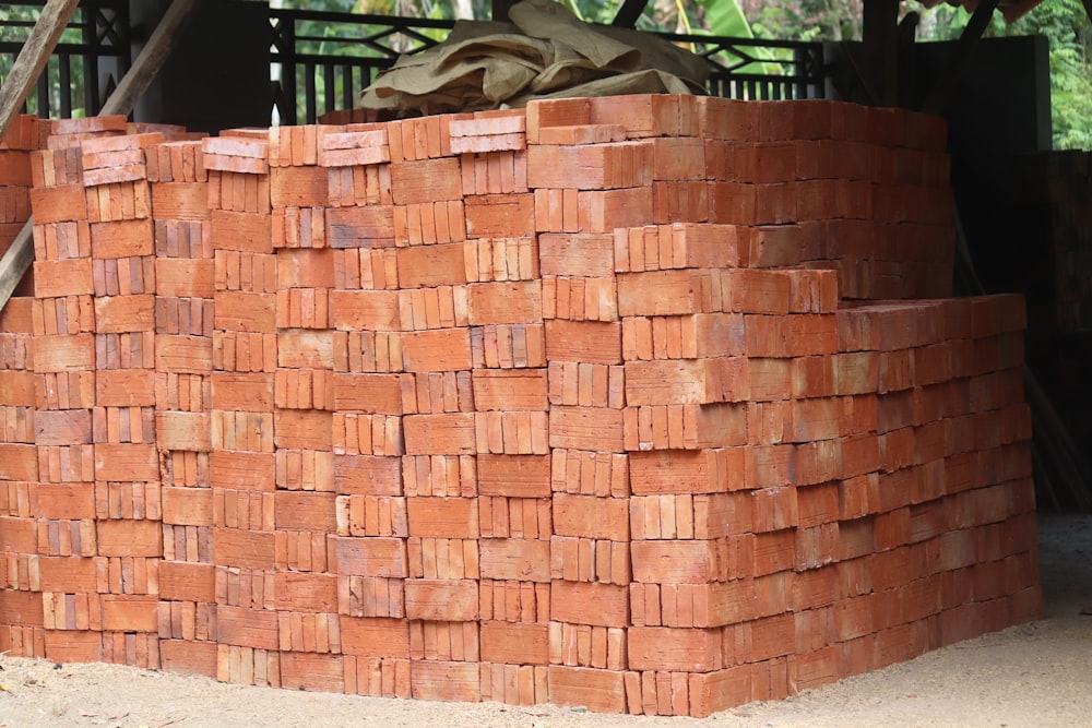 a pile of bricks sitting on top of a sidewalk