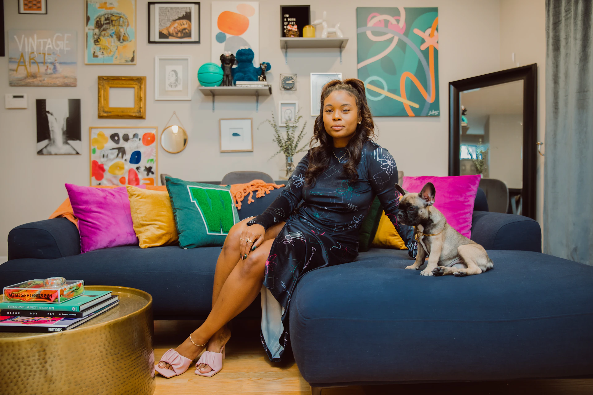 a woman sitting on a couch with a dog