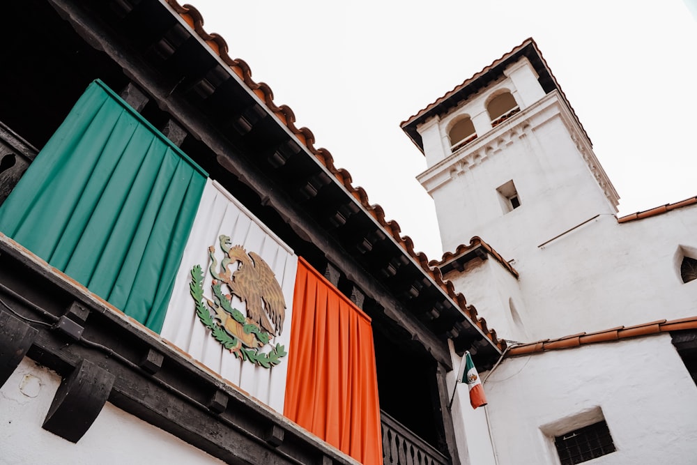 a building with a flag hanging from it's side