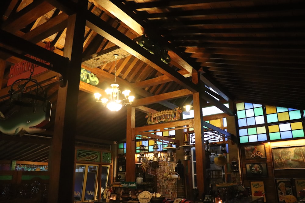 a restaurant with stained glass windows and a wooden ceiling