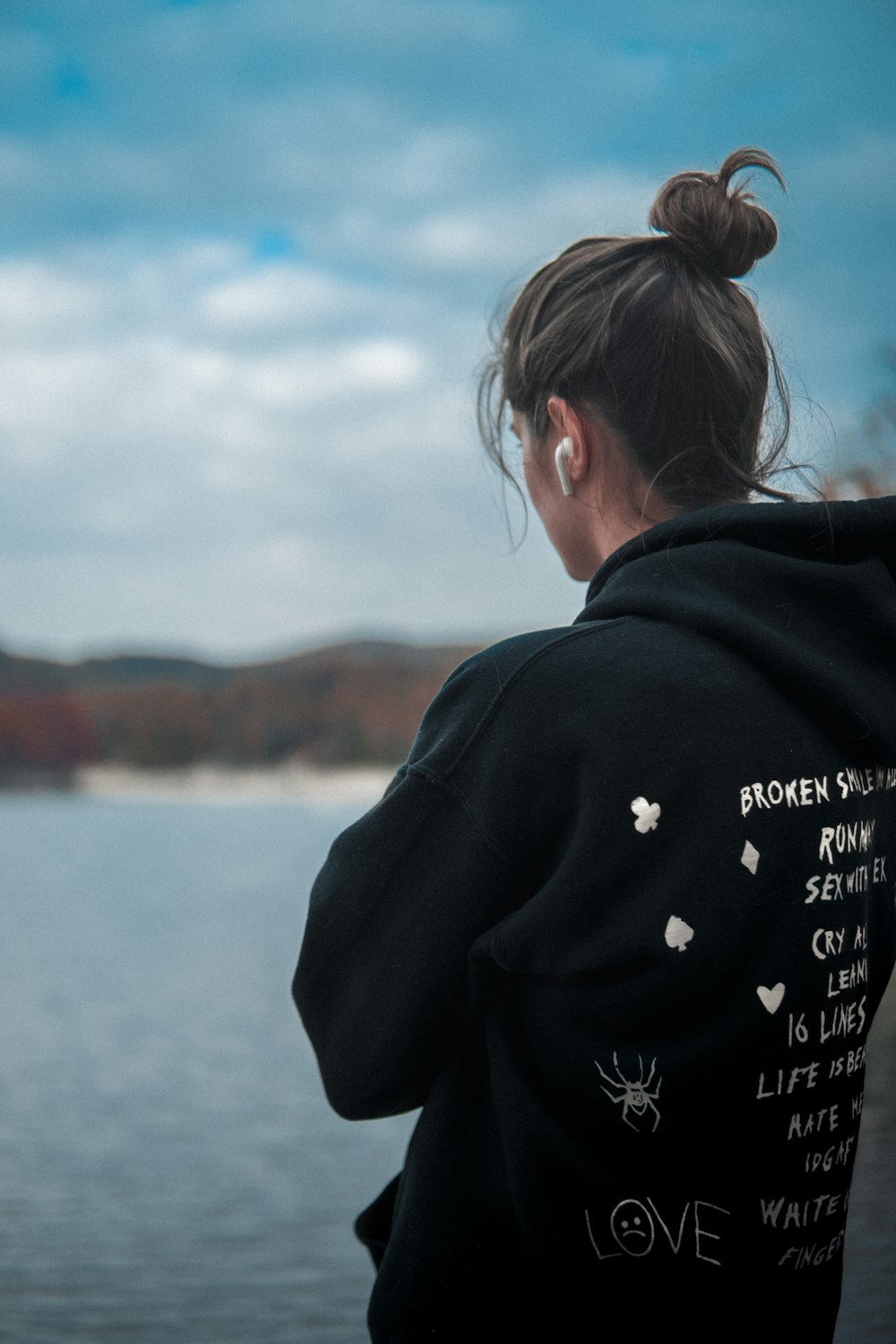 a woman is looking out over a body of water