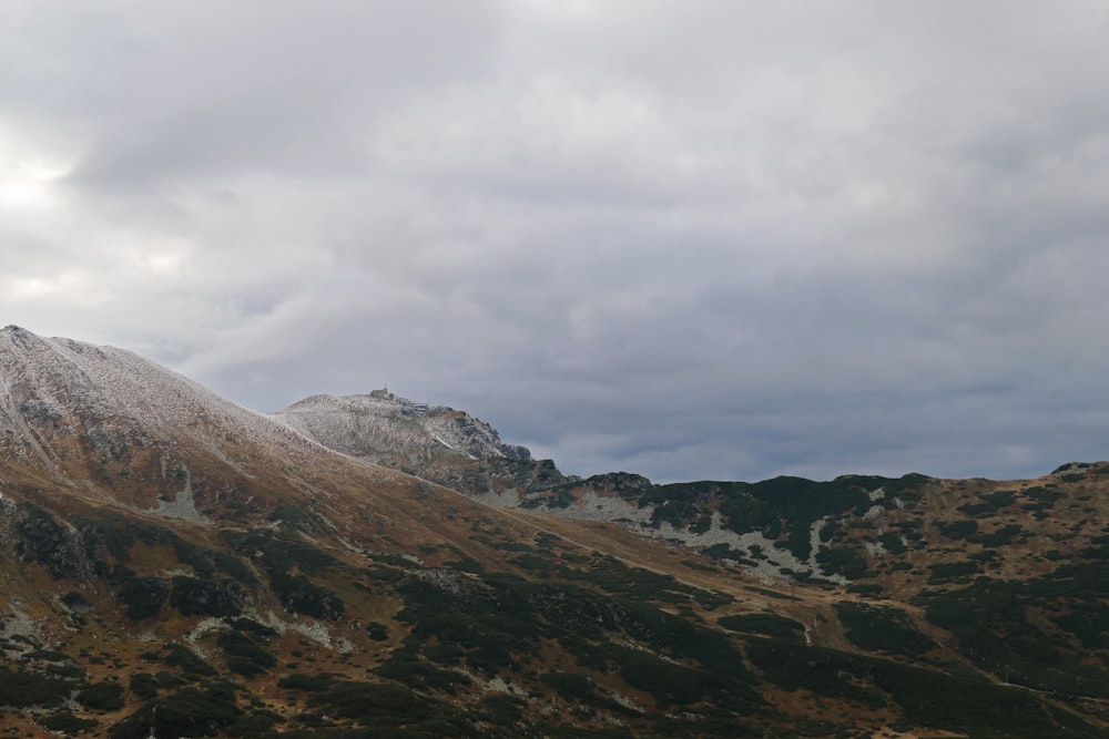 a view of a mountain range with a cloudy sky