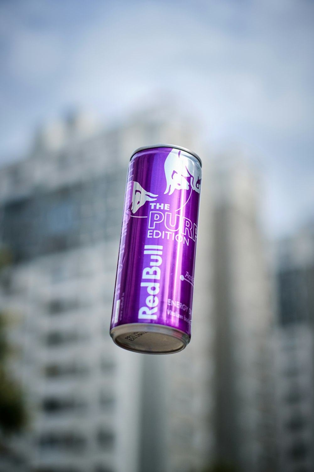 a can of beer hanging in the air