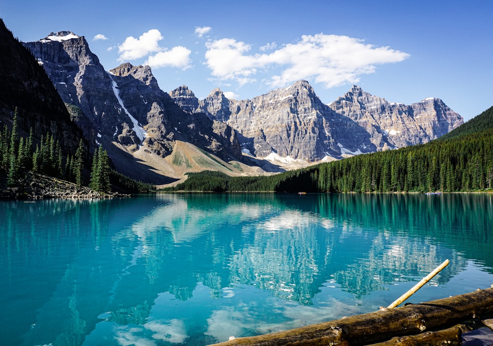 a mountain lake surrounded by trees and mountains