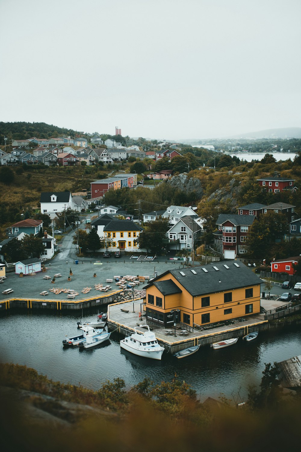 a boat dock with a yellow building on it