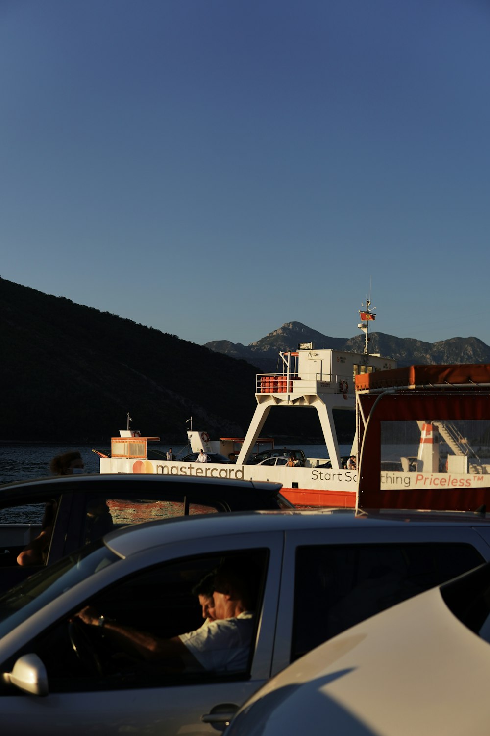 a car is parked in front of a boat