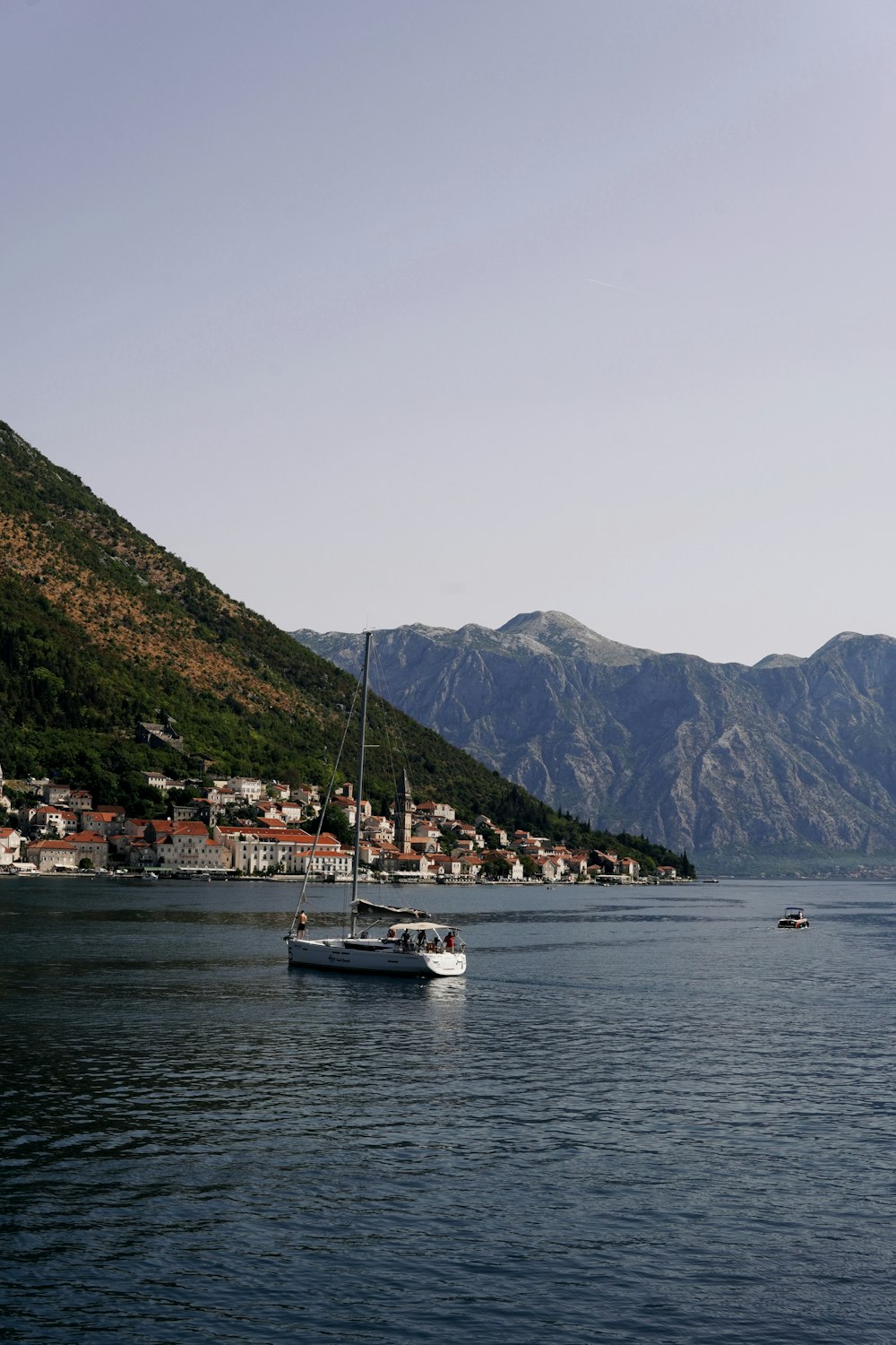 a boat floating on top of a large body of water