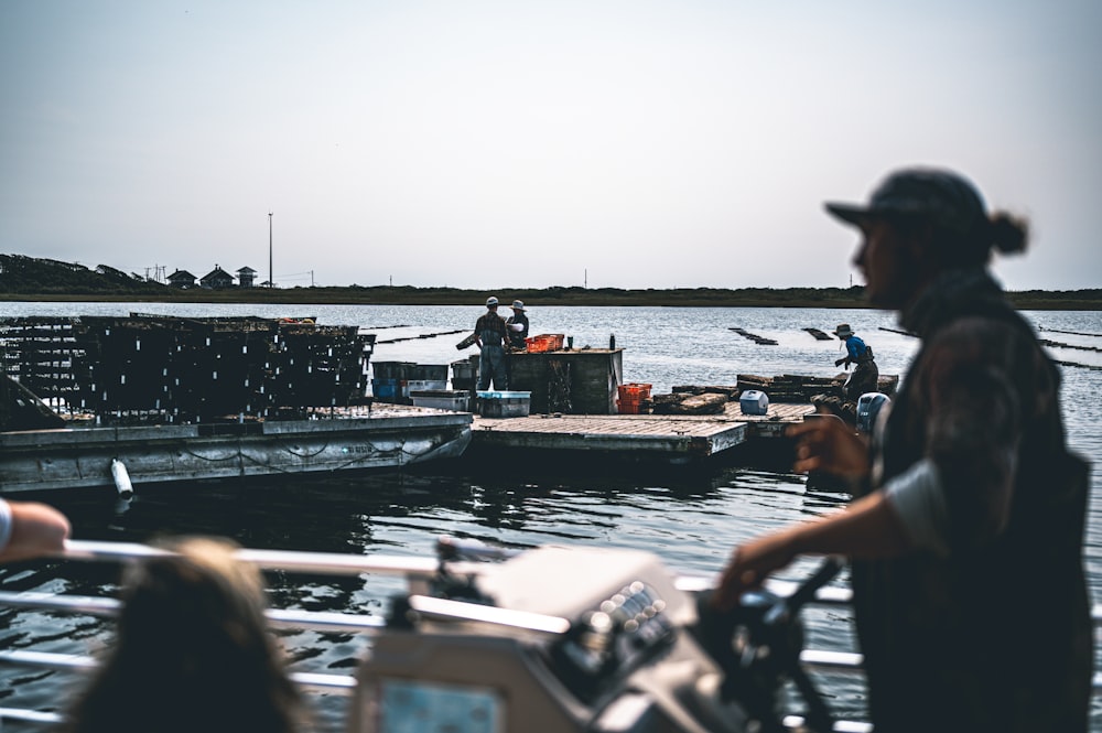 a group of people on a boat in the water