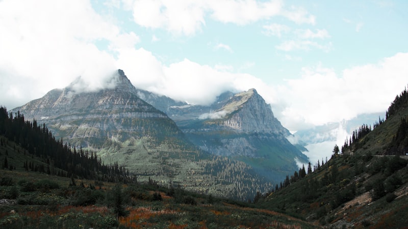 Mountain range in Glacier National Park with clouds