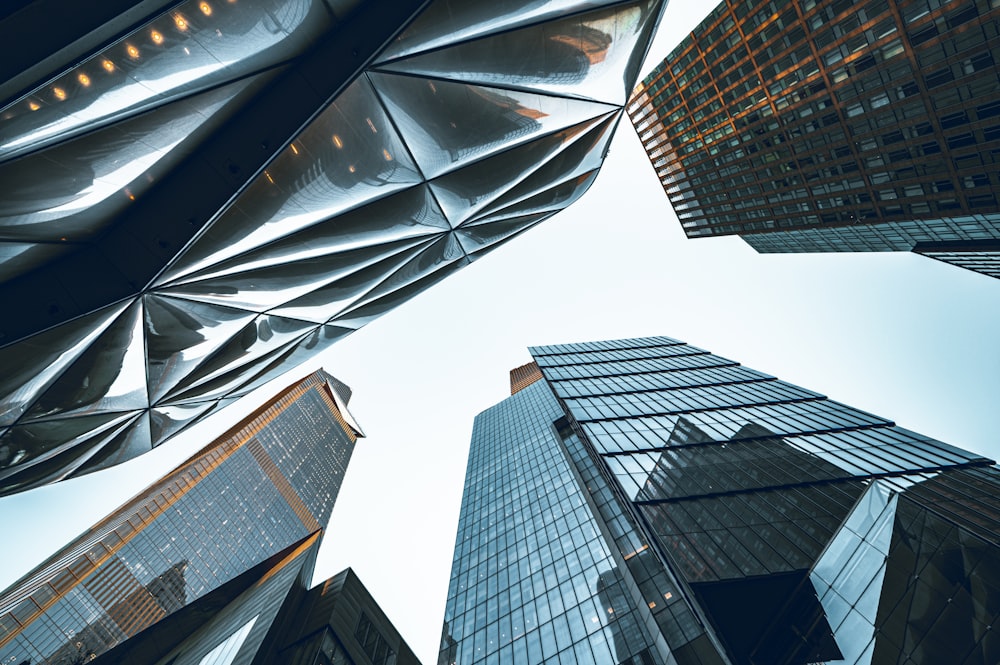 looking up at skyscrapers from the ground