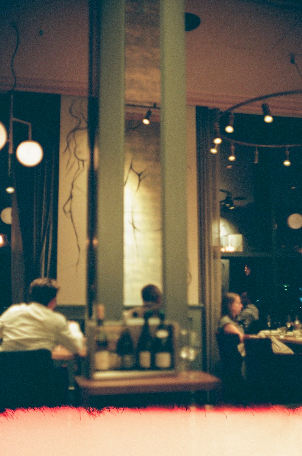 a group of people sitting at a table in a restaurant