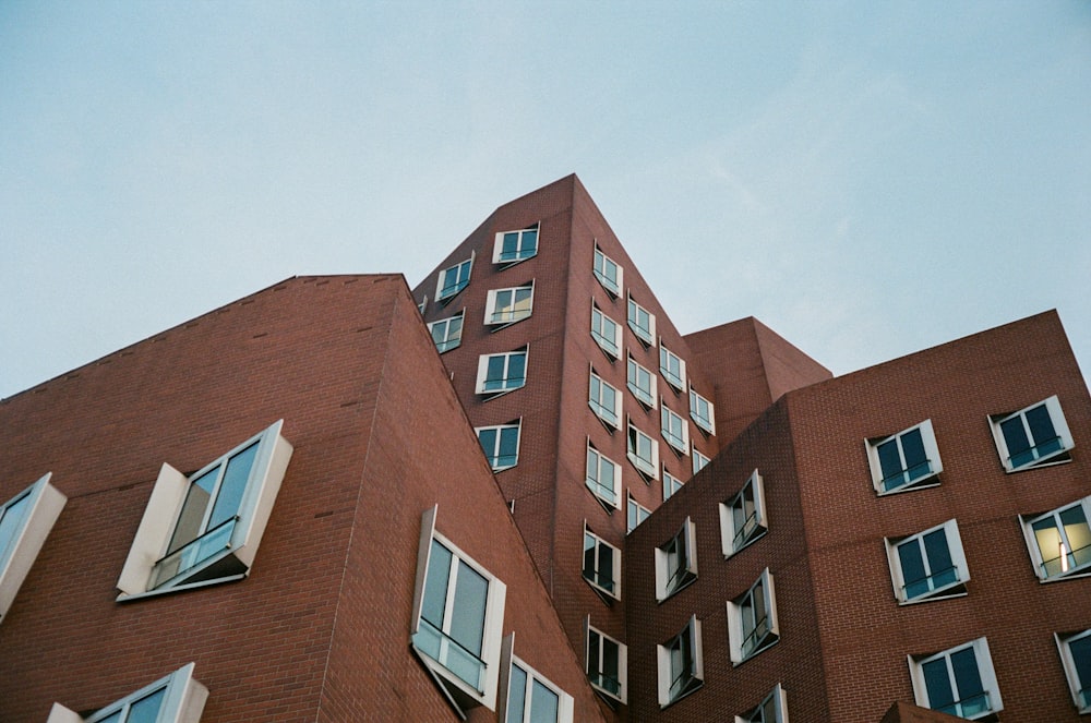 a tall red brick building with many windows