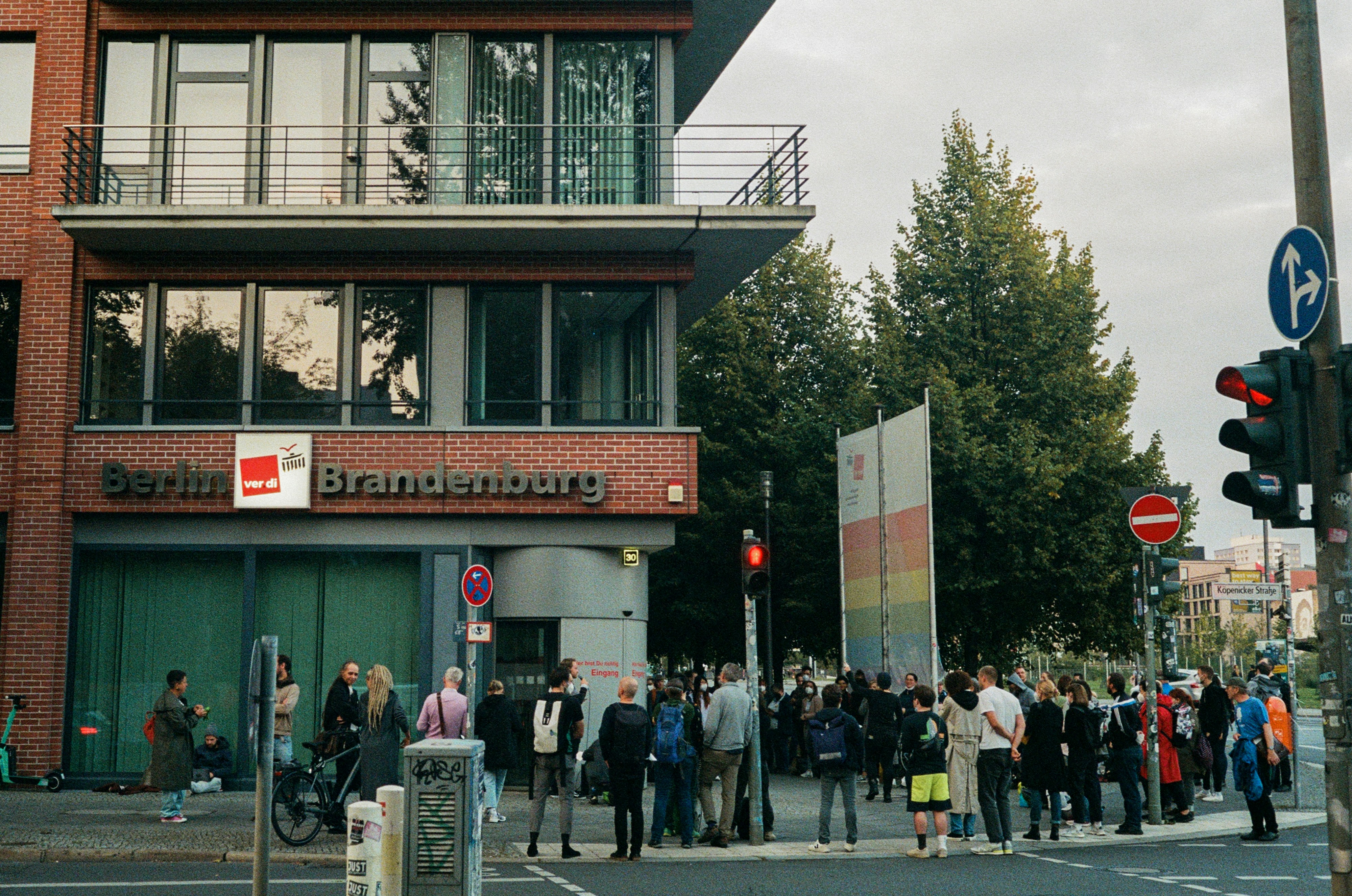 a group of people standing outside of a building
