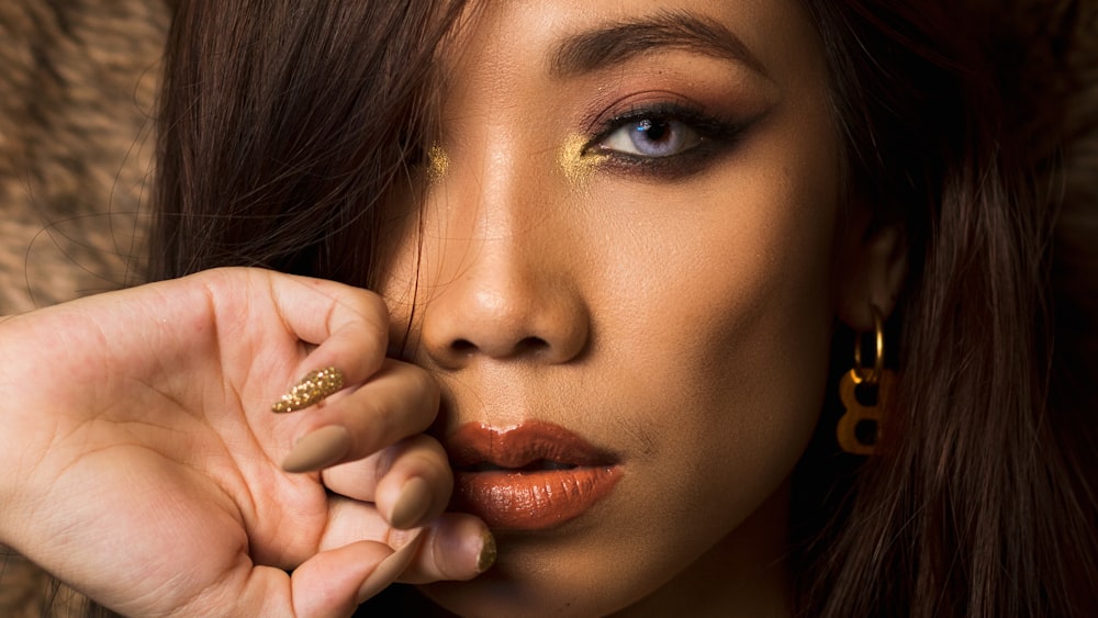 a close up of a person with a ring on her finger