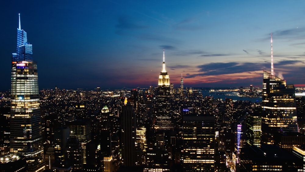 a view of a city at night from the top of a building