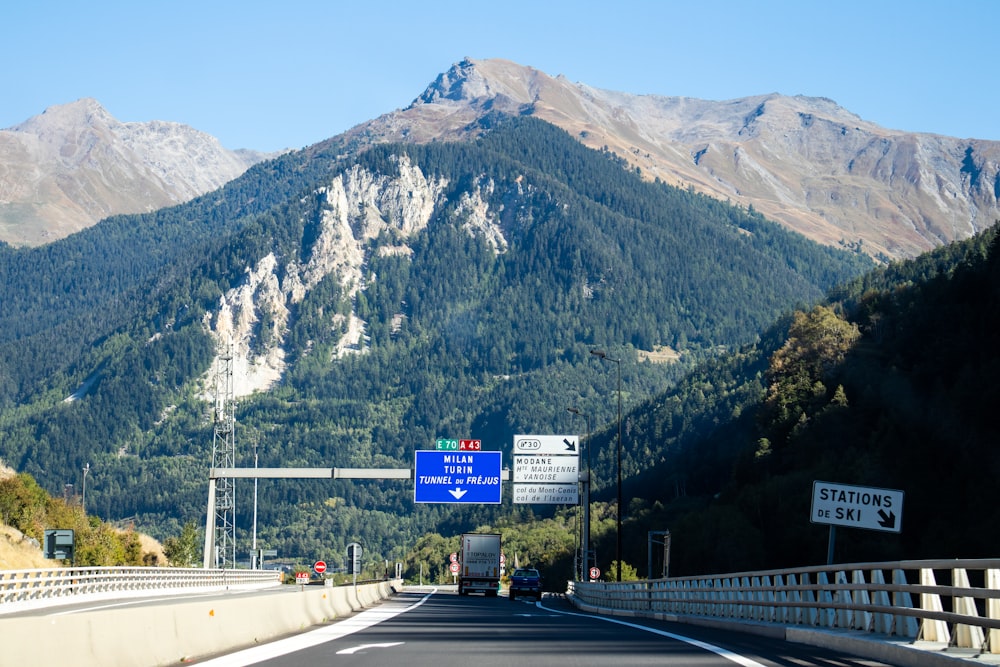 a highway with a mountain in the background