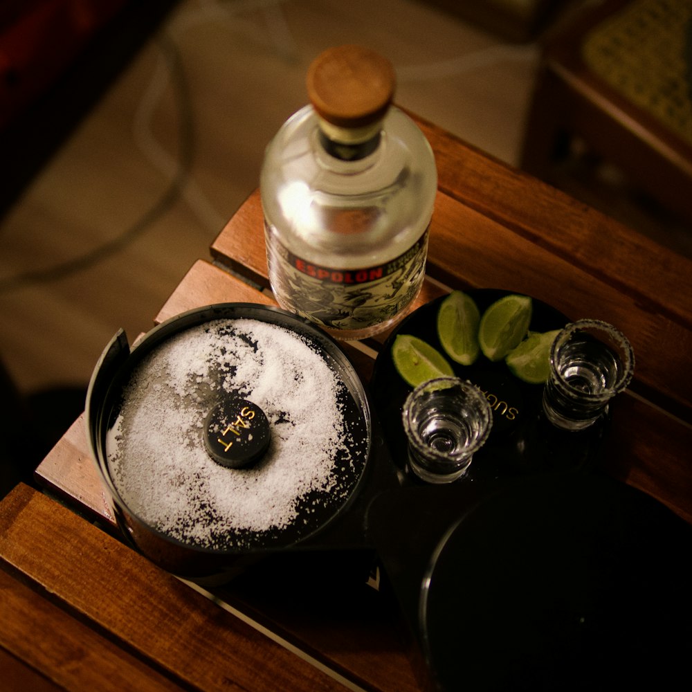 a wooden table topped with a metal pan filled with food