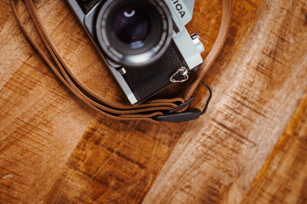 a camera sitting on top of a wooden table