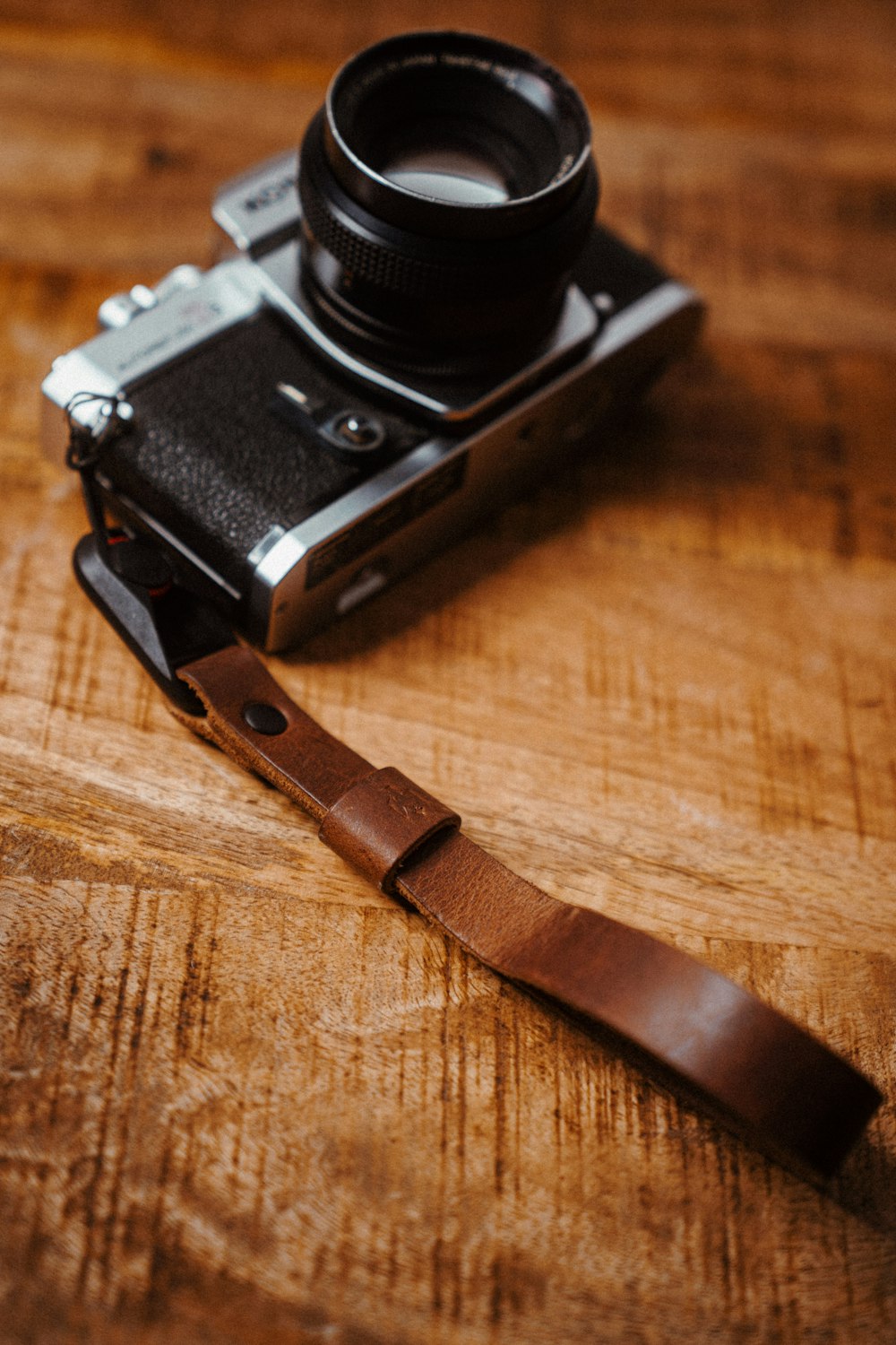 a camera sitting on top of a wooden table