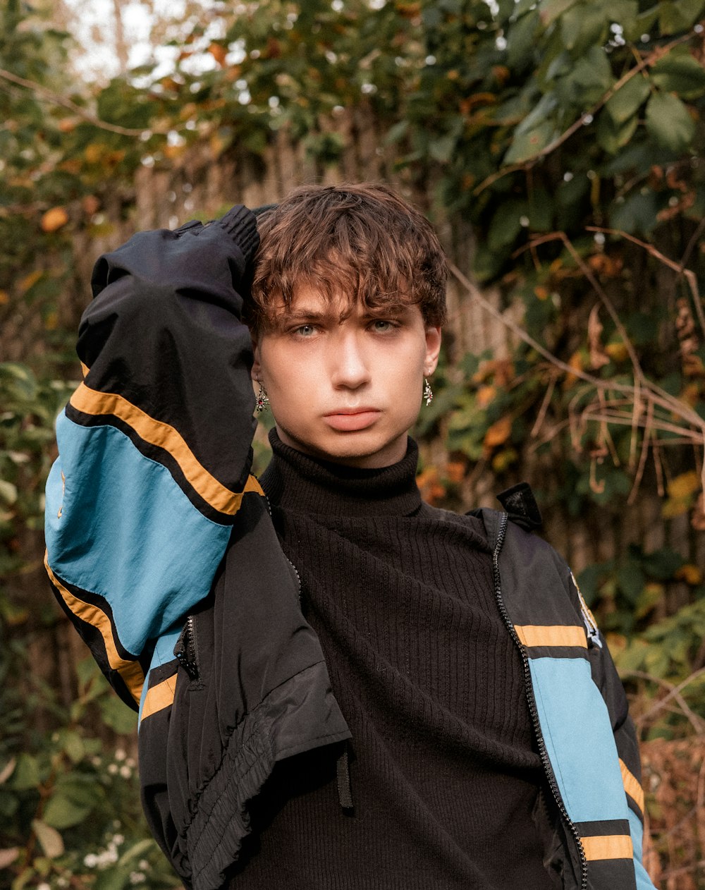 a young man is posing for a picture