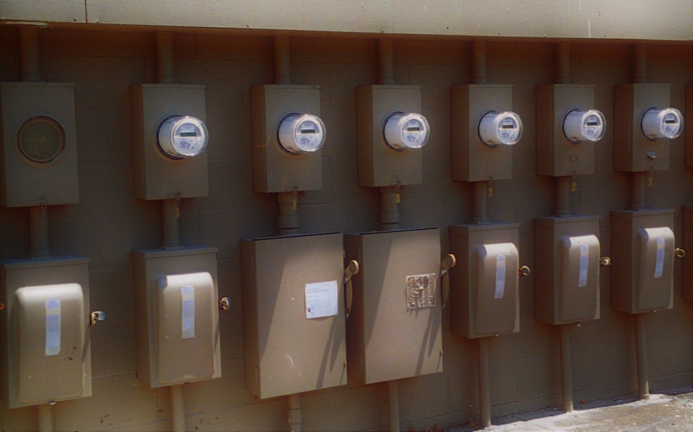 a row of urinals mounted to the side of a building