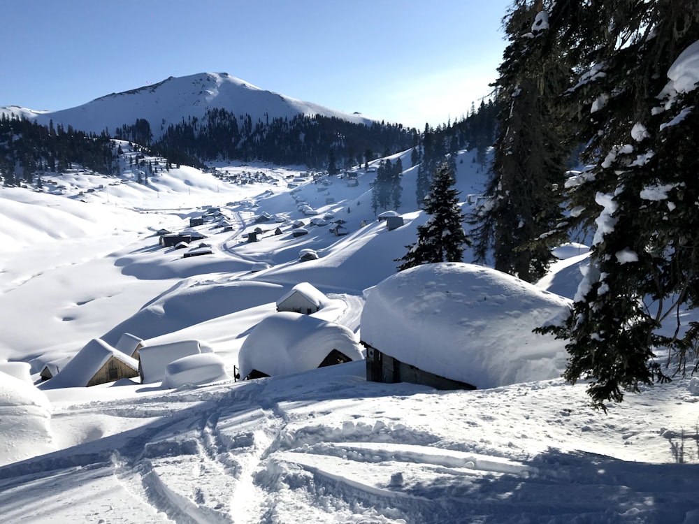 a snow covered mountain with lots of snow on top of it