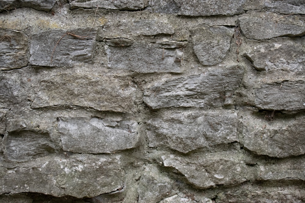 a close up of a stone wall made of rocks