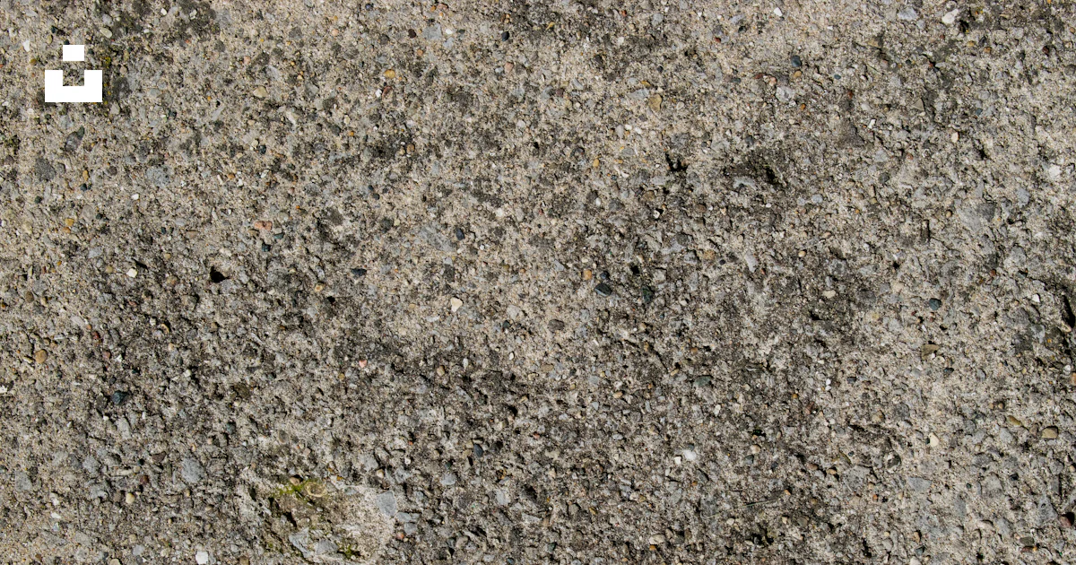 Cement With Rocks A close up of a cement surface with small rocks photo – Free Au gres ...