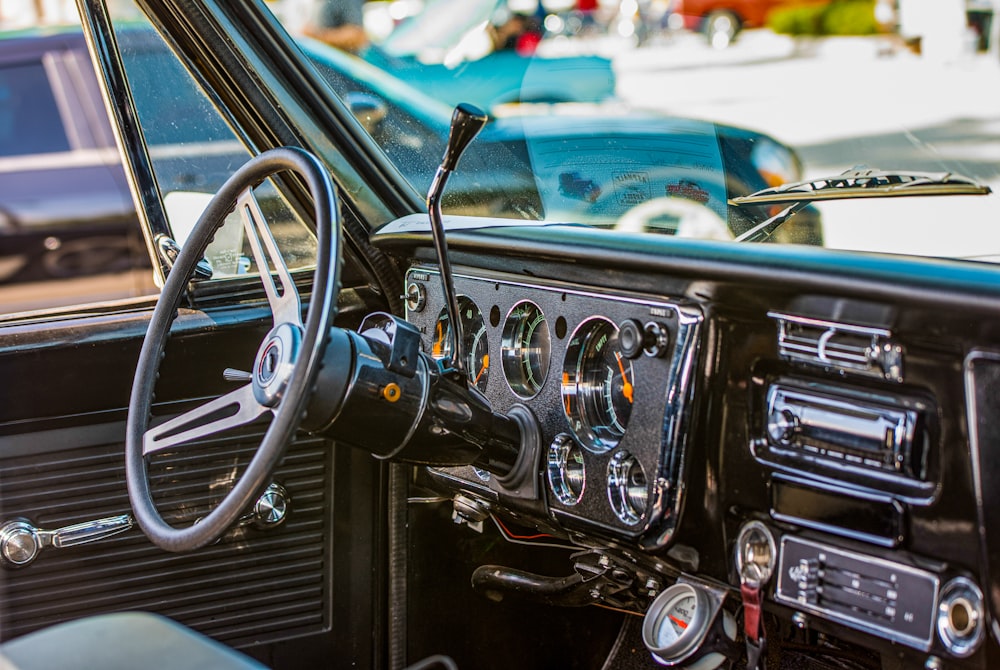 a dashboard of a car with a steering wheel