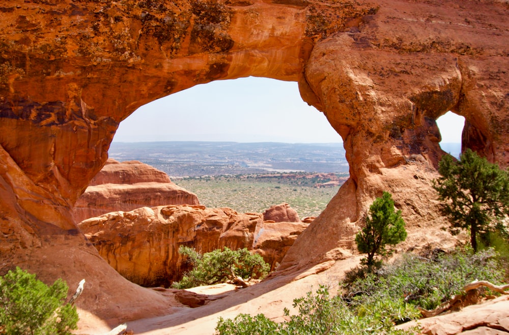 a large rock formation in the middle of a desert