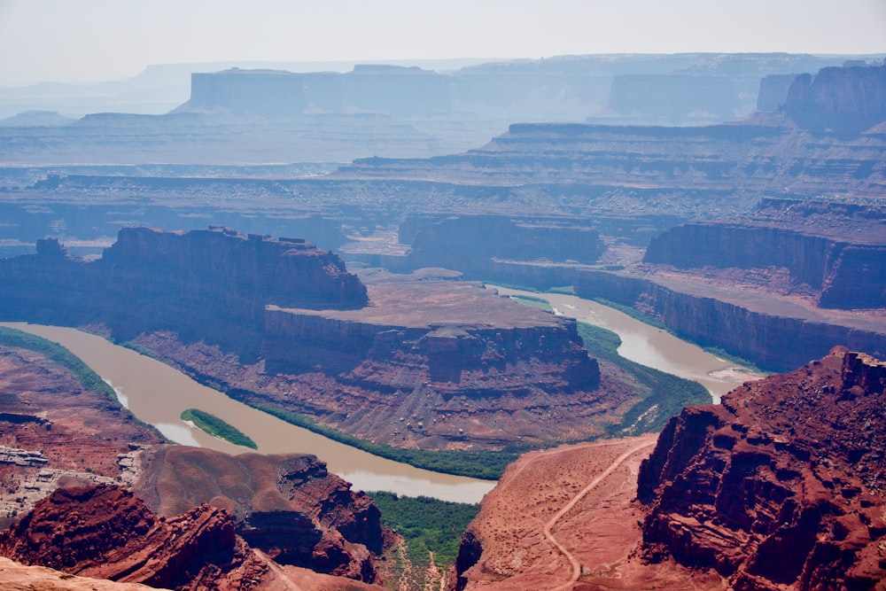 a river running through a canyon surrounded by mountains