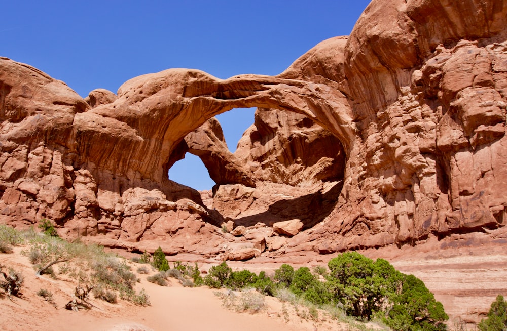 a large rock formation with an arch in the middle of it