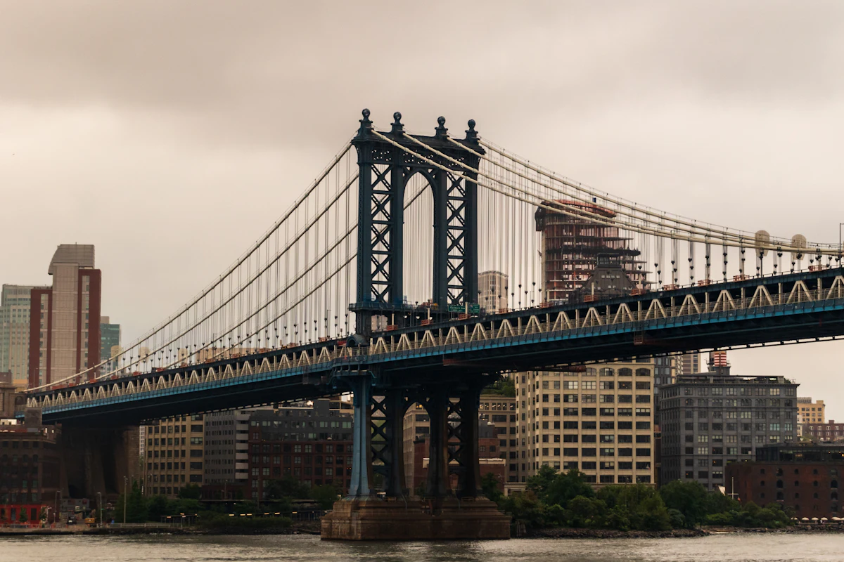 Suspension bridge with massive piers rising from the water — where Texas Tuff Rock Bags are placed as a scour countermeasure ring around the foundation
