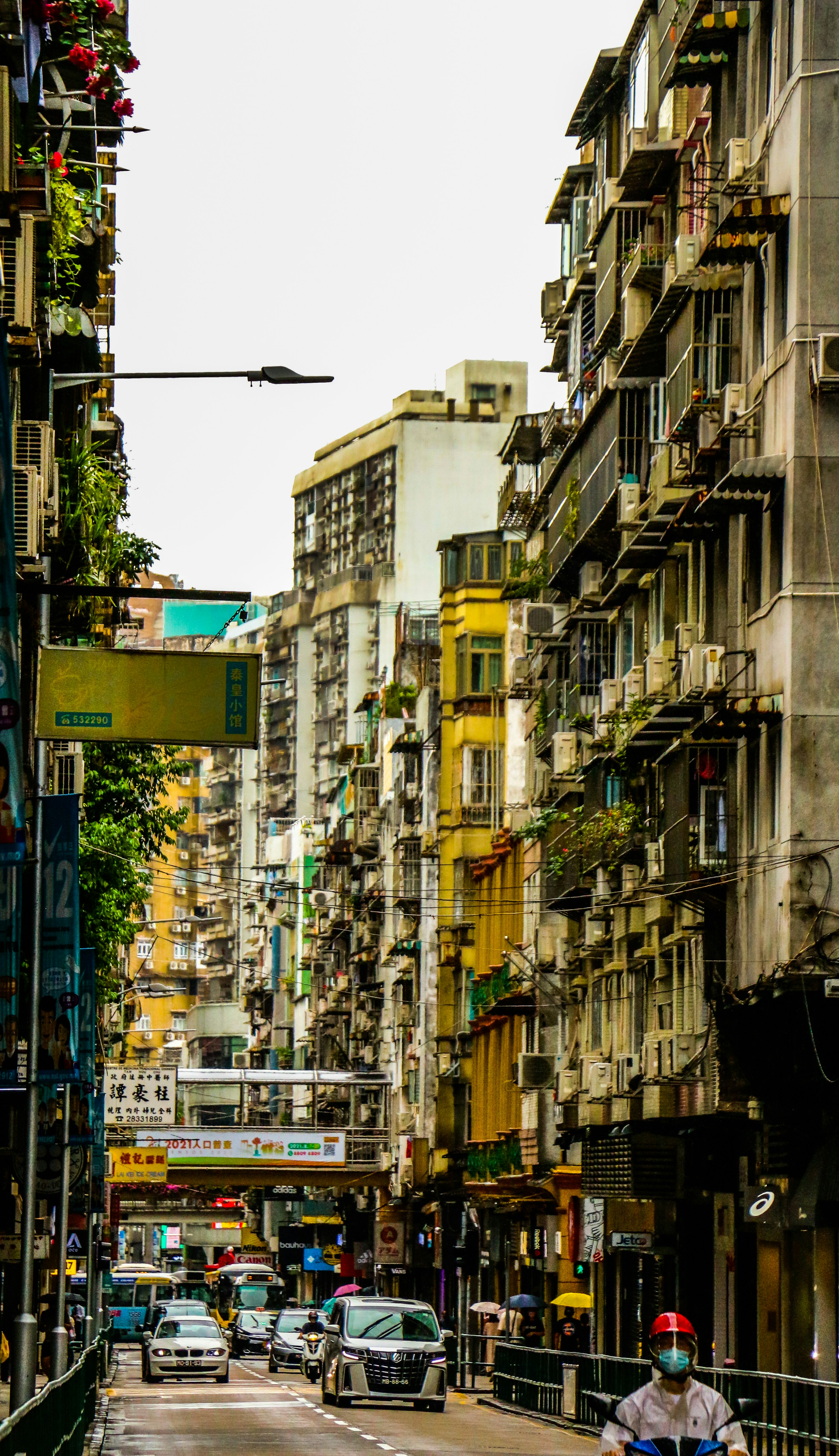 Dense urban city street with taxis and pedestrians at rush hour