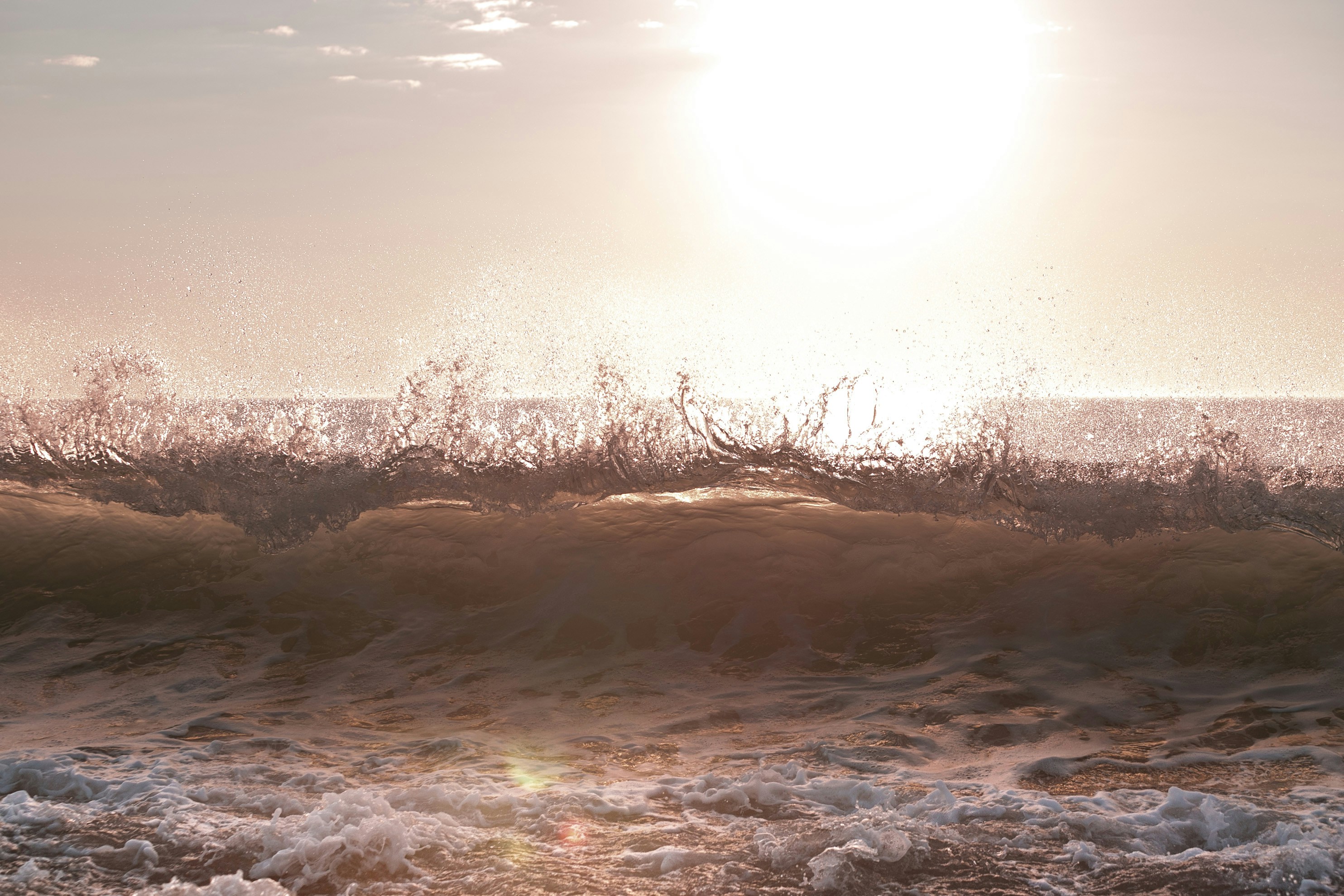 a person riding a surfboard on a wave in the ocean