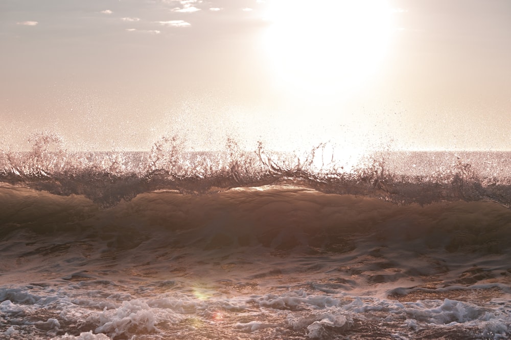 a person riding a surfboard on a wave in the ocean