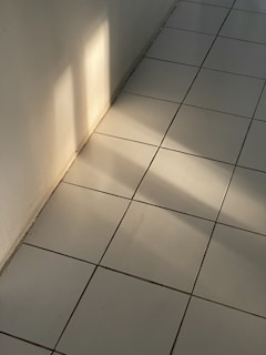 Modern Spanish floor ceramics displayed with natural light highlighting their texture.