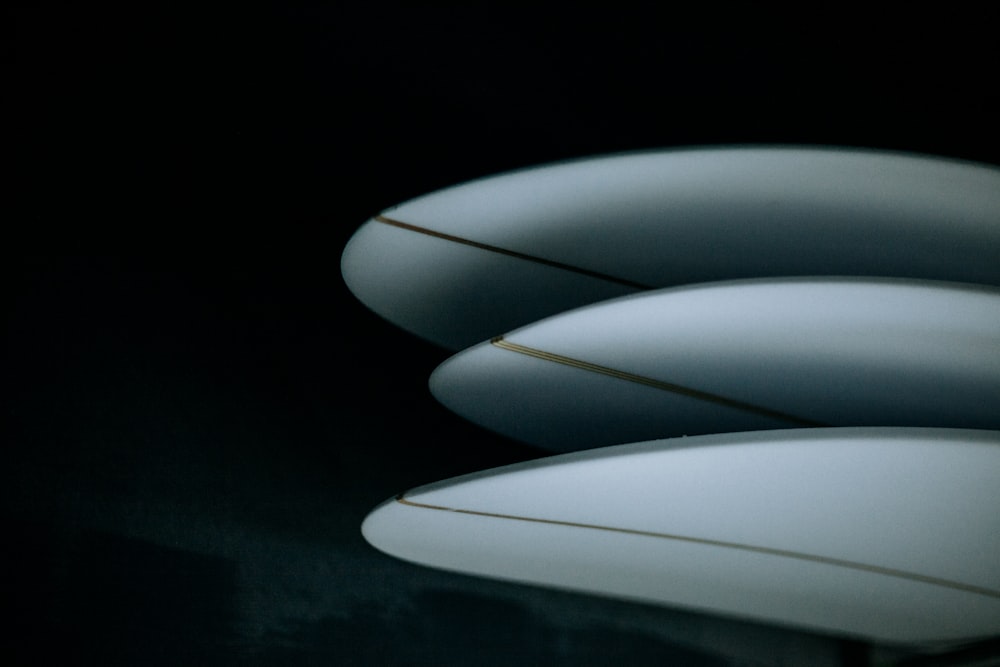 a group of surfboards sitting on top of a table