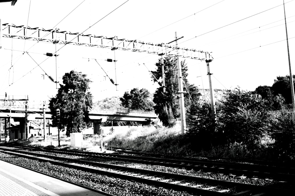 a black and white photo of a train station