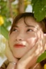 a woman with her hands on her face