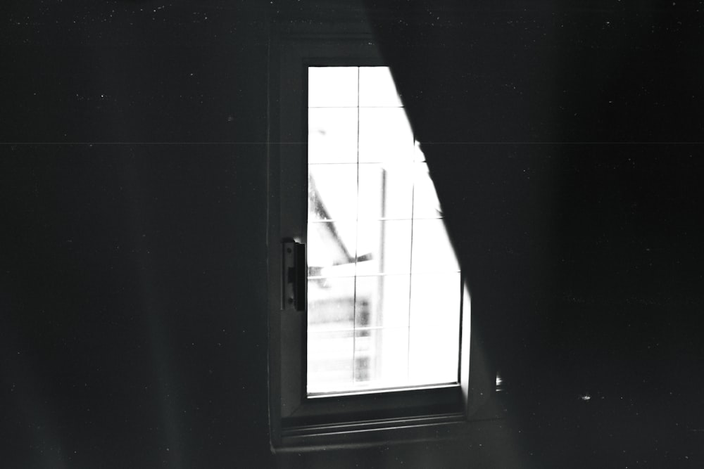 a black and white photo of a window