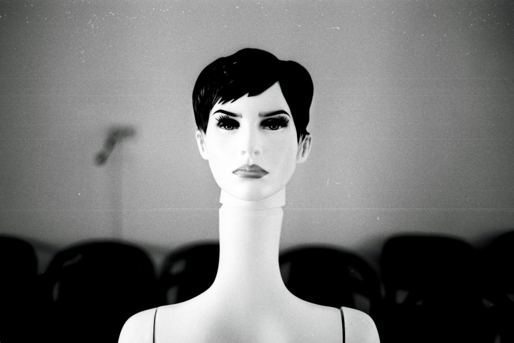 a black and white photo of a mannequin's head