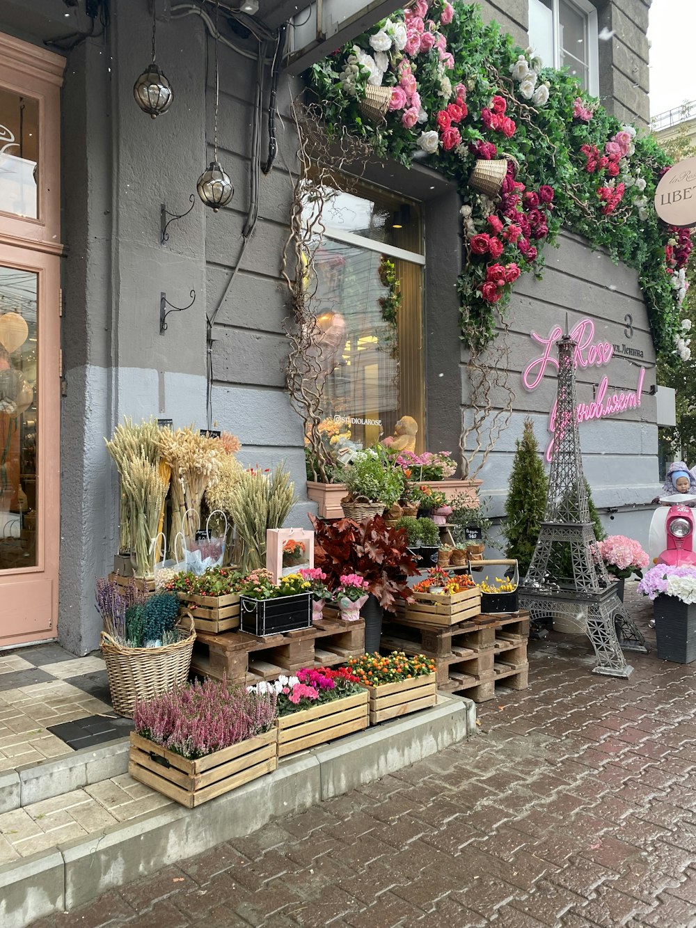 a flower shop with a lot of flowers on display